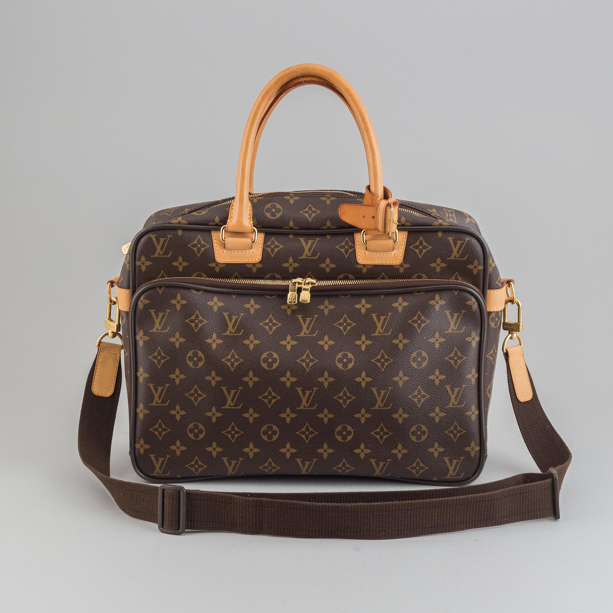 Louis Vuitton, a monogram canvas carry on bag.