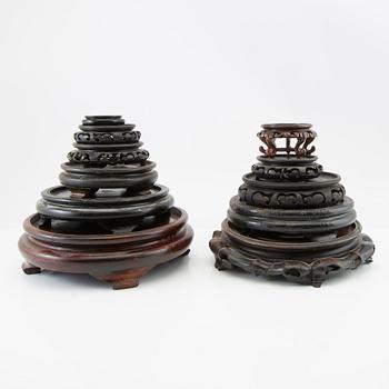 A set of approximately 26 Chinese wooden stands, 20th century.