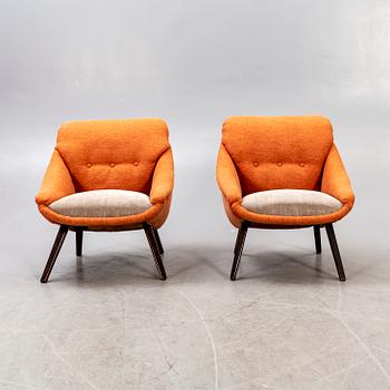 A pair of 1950s easy chairs.