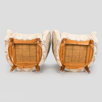 A pair of mid-20th century armchairs.