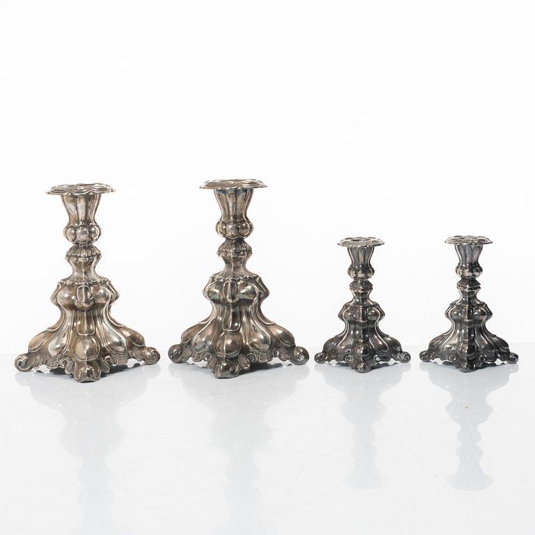 Four Baroque style silver candlesticks, 20th century.