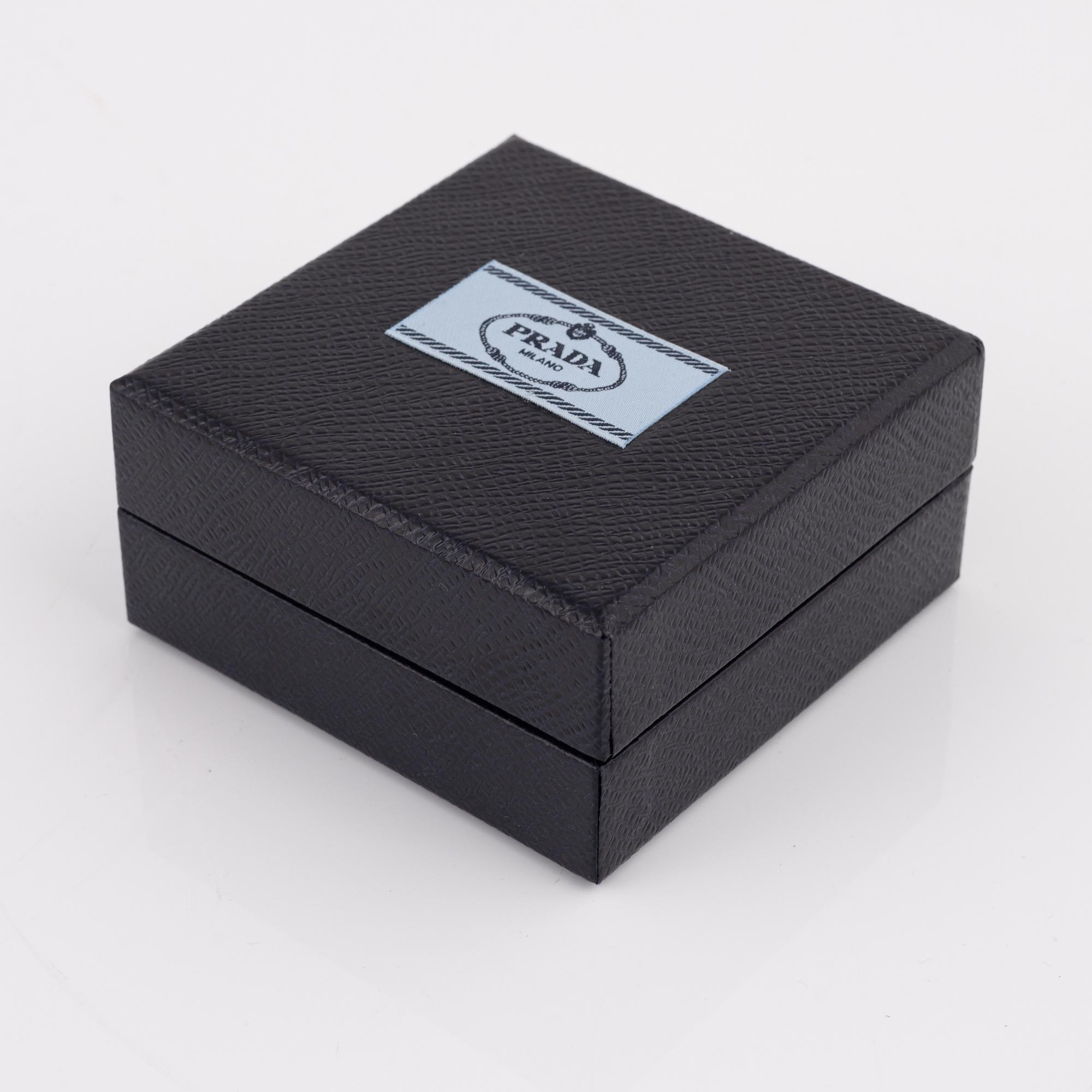 Prada, a pair of clip-on rhinestone and strass earrings.