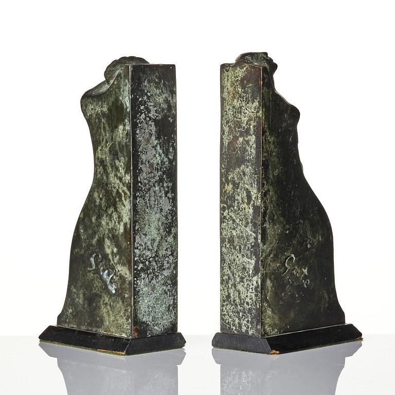 Axel Gute, a pair of Swedish Grace patinated bronze bookends, 1920s.