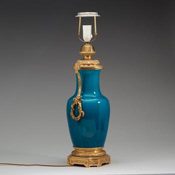 A turquoise glazed bronze mounted porcelain vase, Qing dynasty, 19th century.