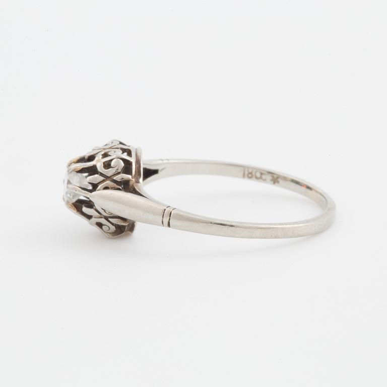 A ring set with a transitional-cut diamond.