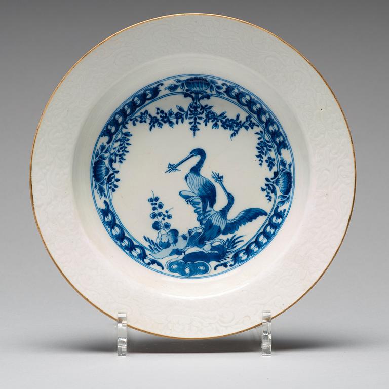 A set of eight blue and white armorial soup dishes, Qing dynasty, 18th Century.
