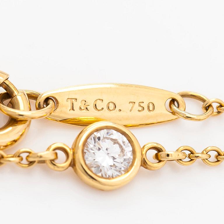 Tiffany & Co, Elsa Peretti, an 18K gold bracelet, 'Diamonds by the Yard', with a diamond approximately 0.08 ct.