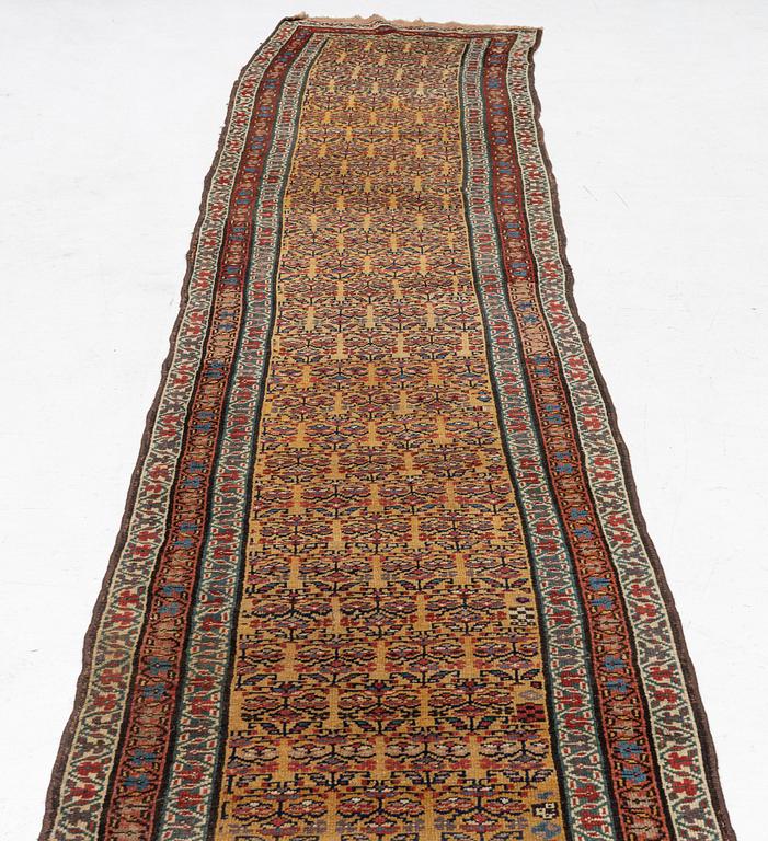 An antique Kurdish runner, c 460 x 84 cm.