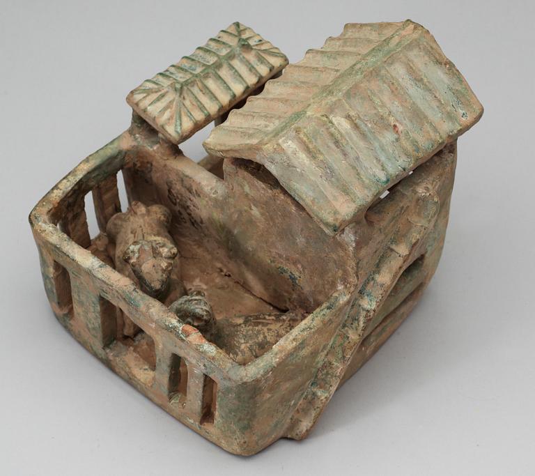 A green glazed pottery model of a house, Han dynasty (206 BC-220 AD).