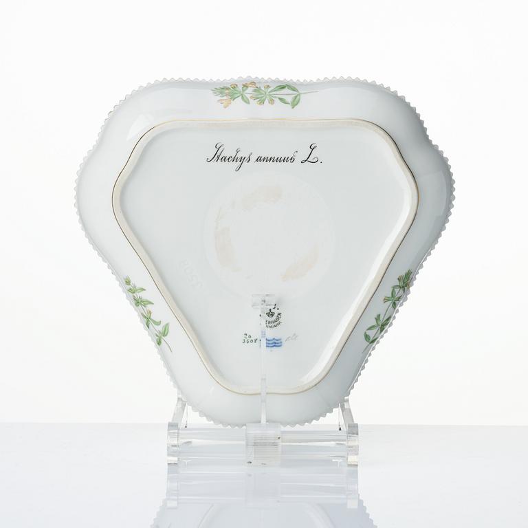 A set with a Royal Copenhagen 'Flora Danica' triangular dish, a sugar bowl with cover and three small dishes, Denmark,