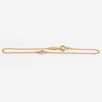 Tiffany & Co, Elsa Peretti, an 18K gold bracelet, 'Diamonds by the Yard', with a diamond approximately 0.08 ct.