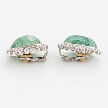 A pair of 18K white gold earrings with cabochon-cut emeralds.