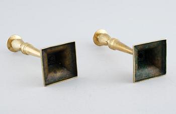 A pair of brass candlesticks, 19th century.