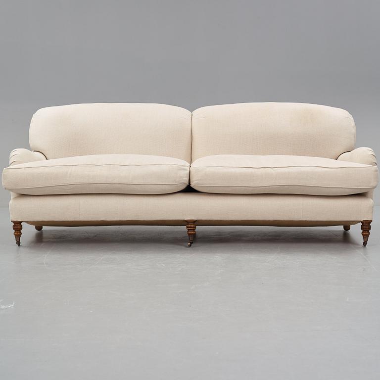 SOFA, "Howard", upholstered in an off-white fabric.