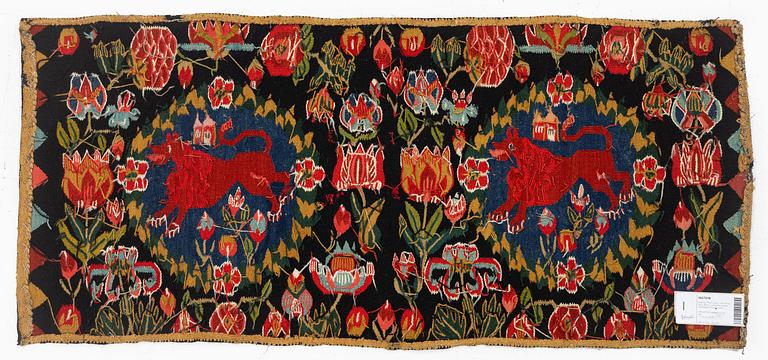 A cushion, 'Red Lion' (Rött Lejon), tapestry weave, c. 102 x 46cm, southwestern Scania, first part of the 19th century.