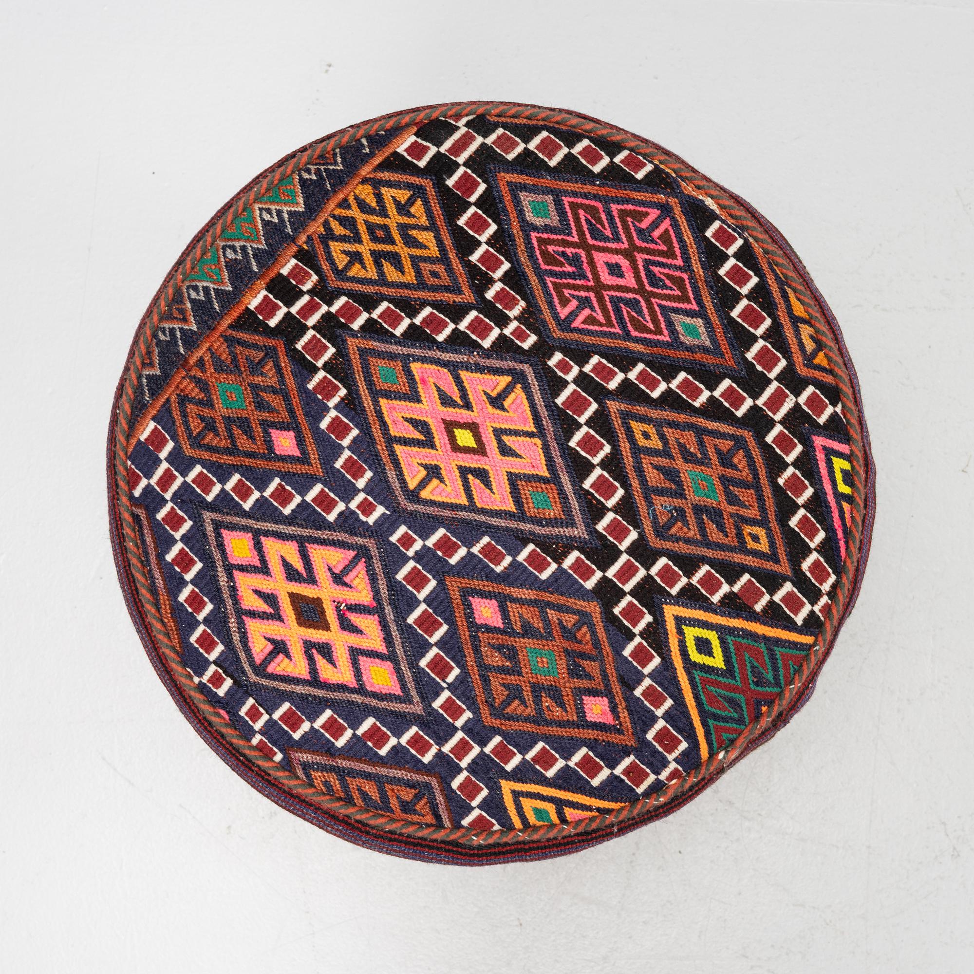 A Kelim covered stool.