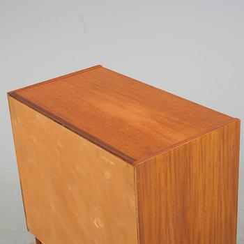 A mid 20th century teak dressing commode.
