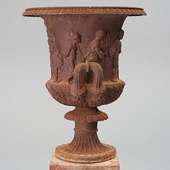 An around year 1900 iron garden Medici vase.