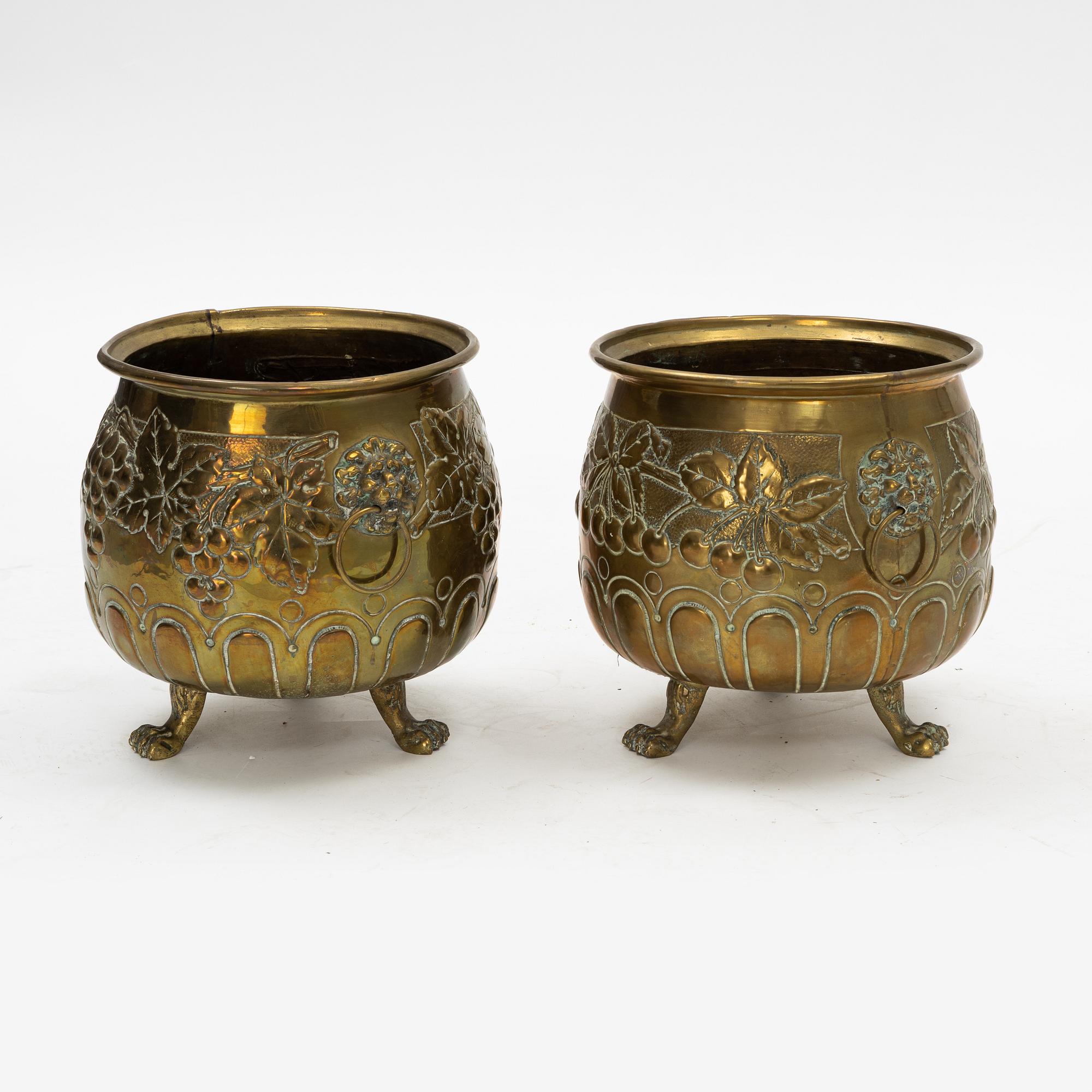 A pair of Baroque style brass plant pots, late 19th Century.