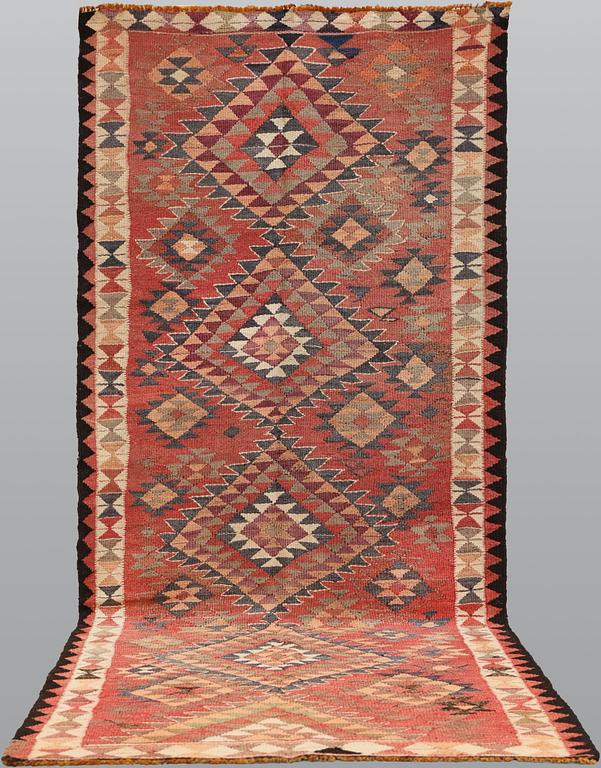 A carpet, Nomad Kelim, c. 345 x 155 cm.