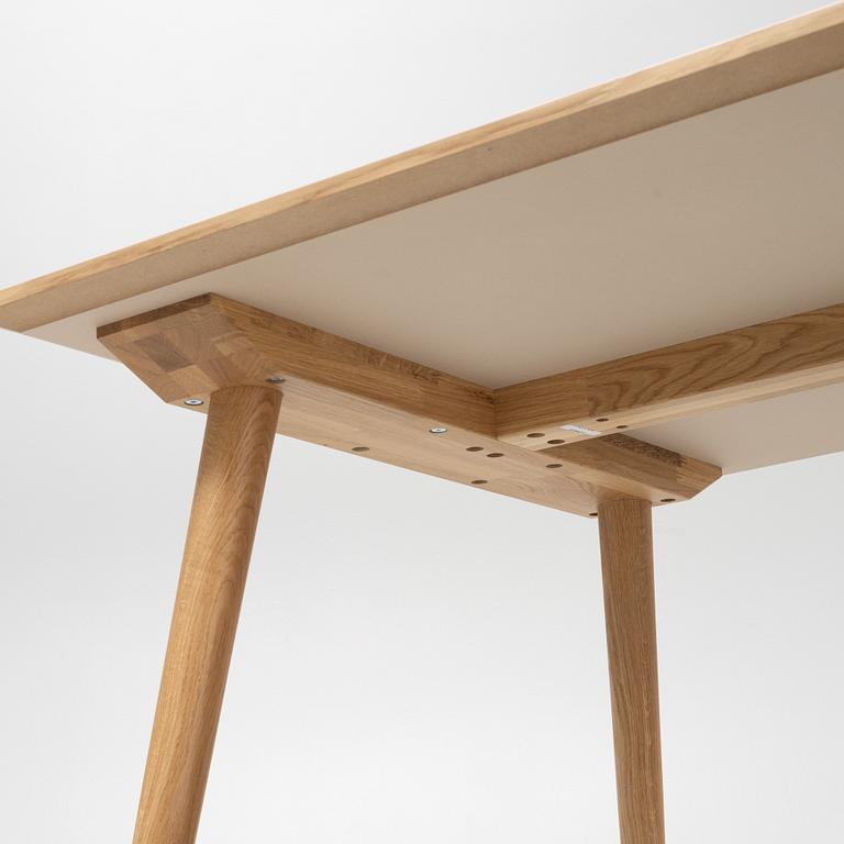 Sami Kallio, an oak veneered 'In Between' dining table from &tradition.