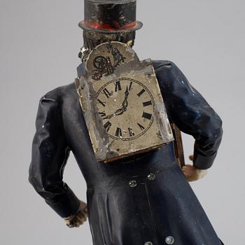 A Black Forest sheet metal figural timepiece, second half of the 19th century.