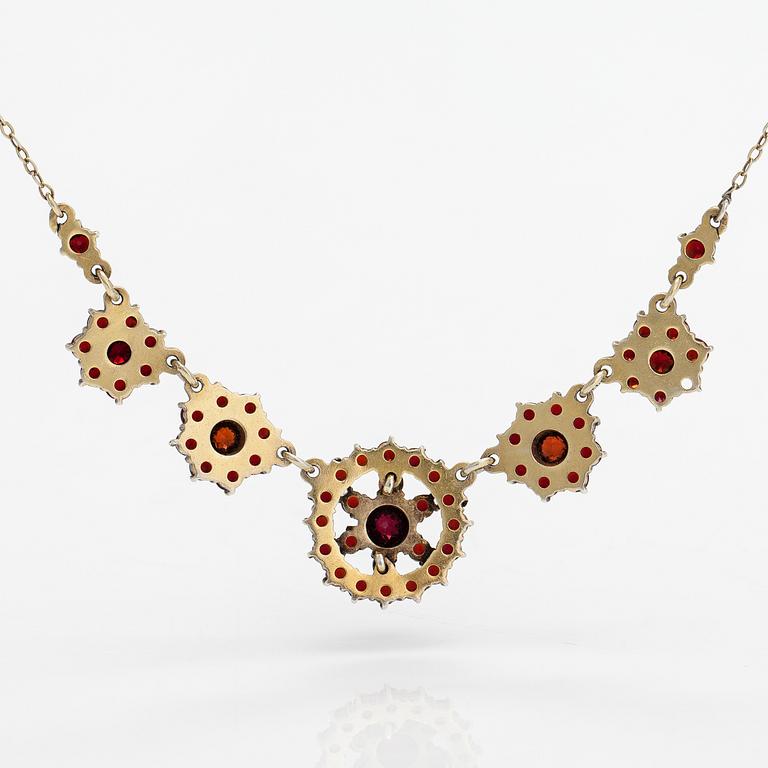 A gilded silver bracelet and necklace with garnets.