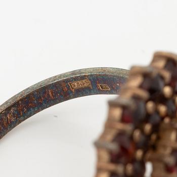 Garniture, two rings, brooch, two necklaces, and two pairs of earrings, armlet, garnets.