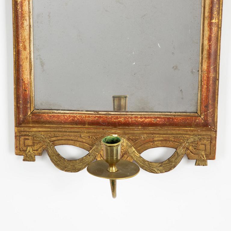 A  Gustavian giltwood one-light girandole mirror by N. Sundström (master in Stockholm 1754-1781).