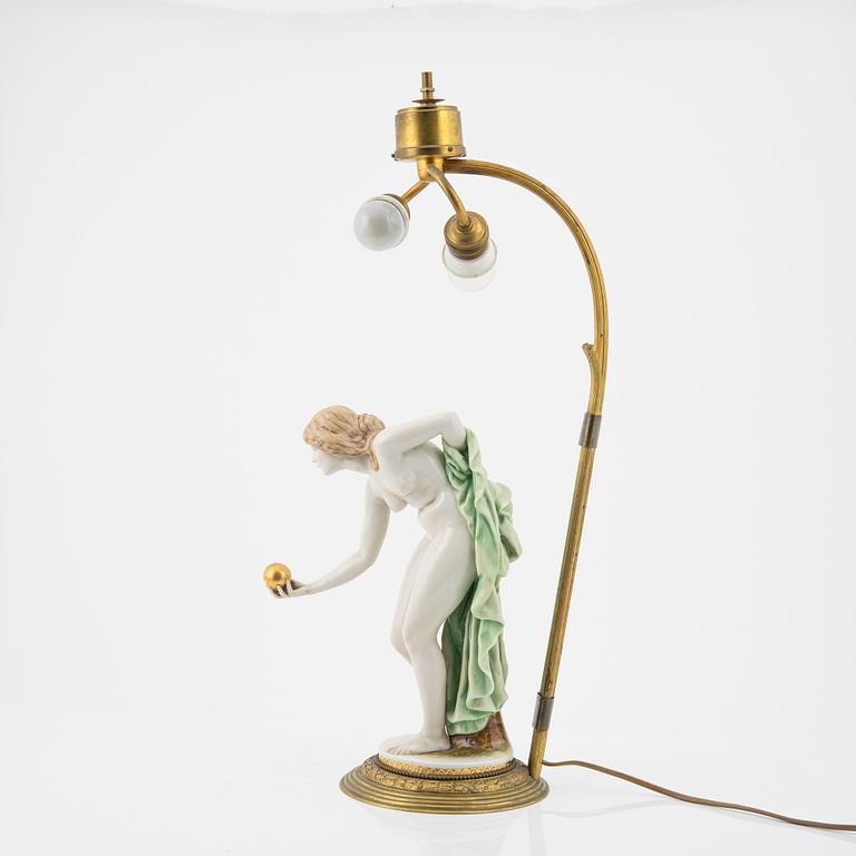 Walter Schott, an early 20th century porcelaine and brass table lamp.