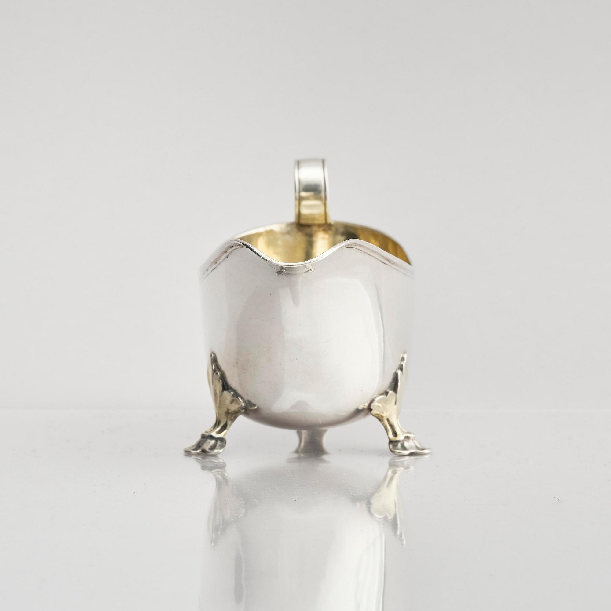 A Swedish early 19th century parcel-gilt cream-jug, mark of Johan Wasserman, Lindesberg, Sweden 1810.