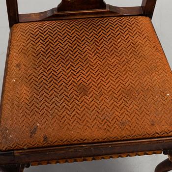 A 1920's 7 piece Chippendale-style dining group.