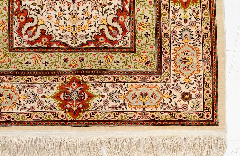 A Hereke silk rug, West Anatolia, c. 107 x 69 cm.