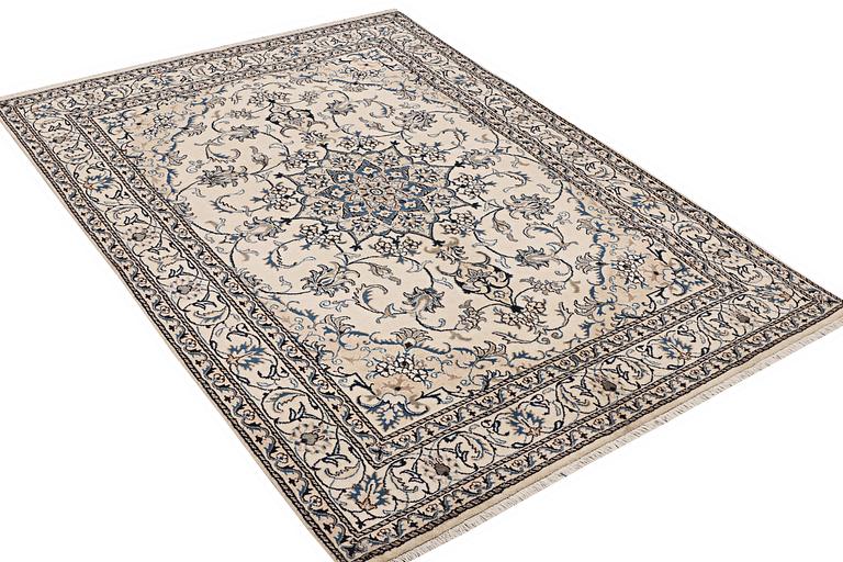 A rug, Nain, part silk, ca. 237 x 167 cm.