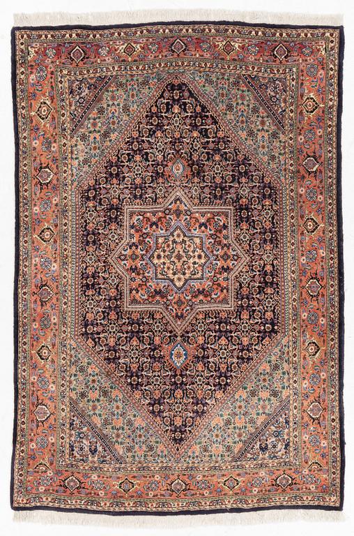 An oriental rug, approx. 203 x 135 cm.