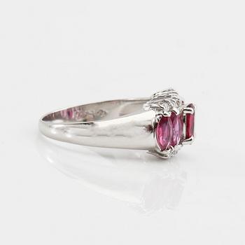 Ring in 850 platinum with navette-cut pink sapphires and round brilliant-cut diamonds.