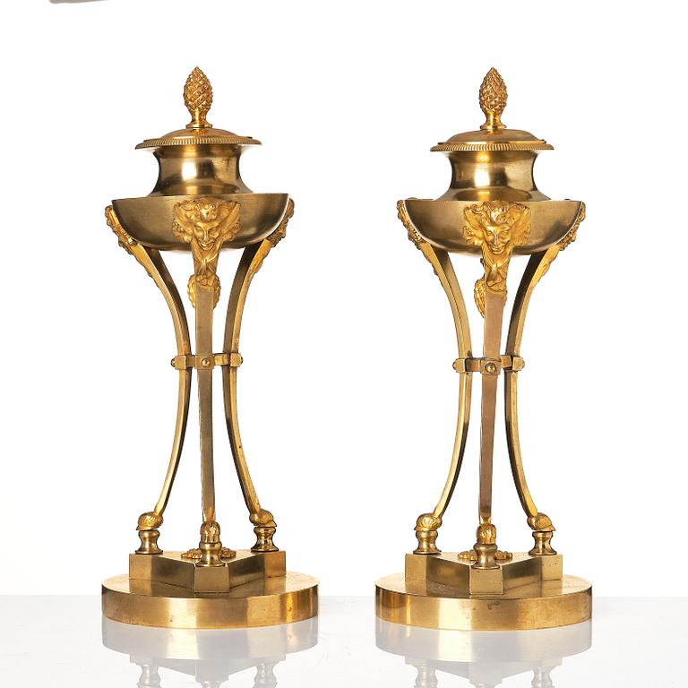 A pair of Empire tripod shaped casolettes.