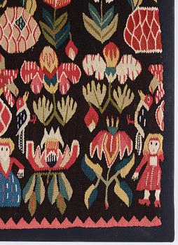 A carrige cushion, 'Urnor & par',  tapestry weave, c. 110 x 53 cm (with mounting 115 x 57 cm), circa 1800-1825.