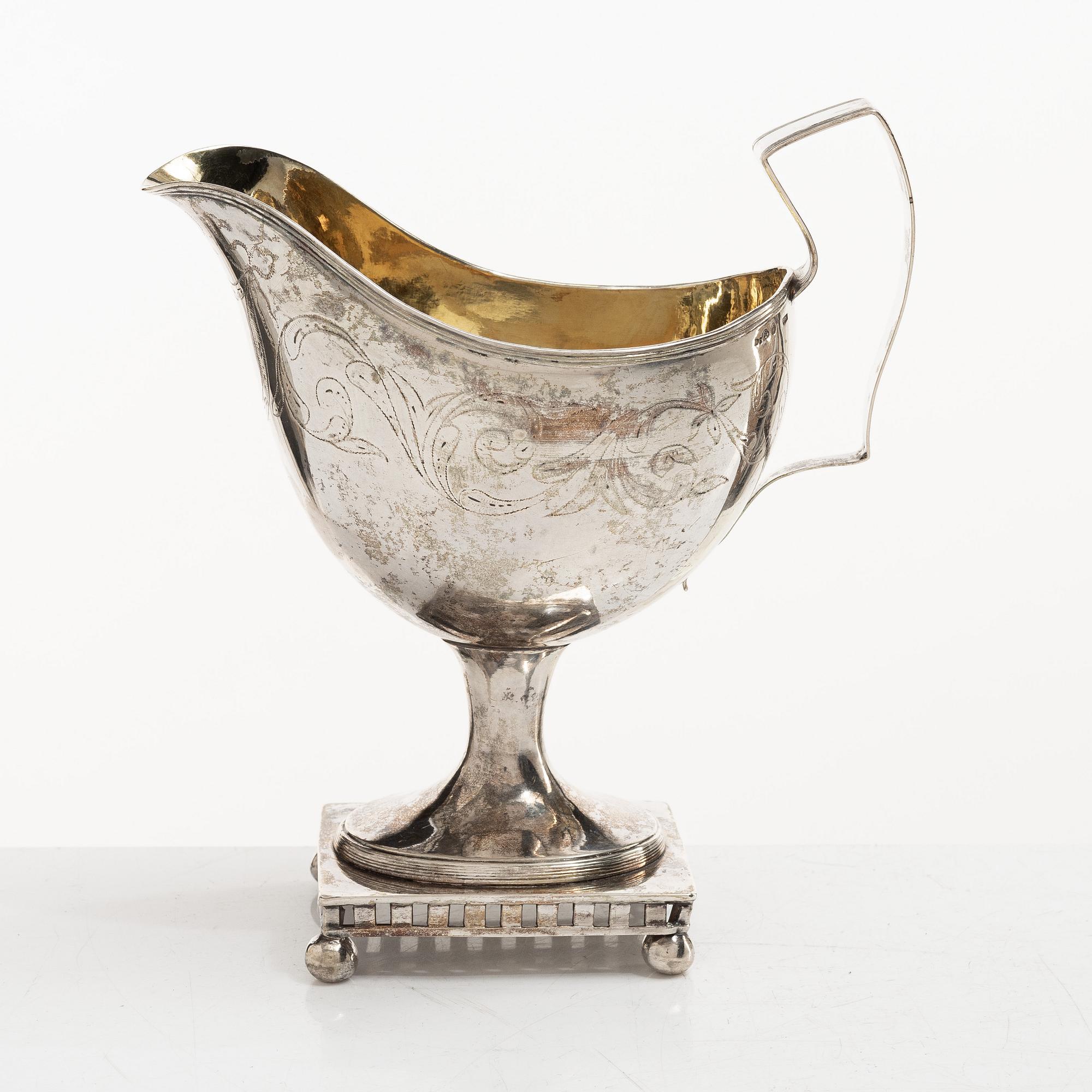 A Swedish Gustavian parcel-gilt silver sauce jug, mark of Daniel Hallman, Stockholm 1810.
