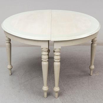 A 19th century dining table in three parts.