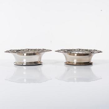 A pair of silver plated coasters, England 20th century.