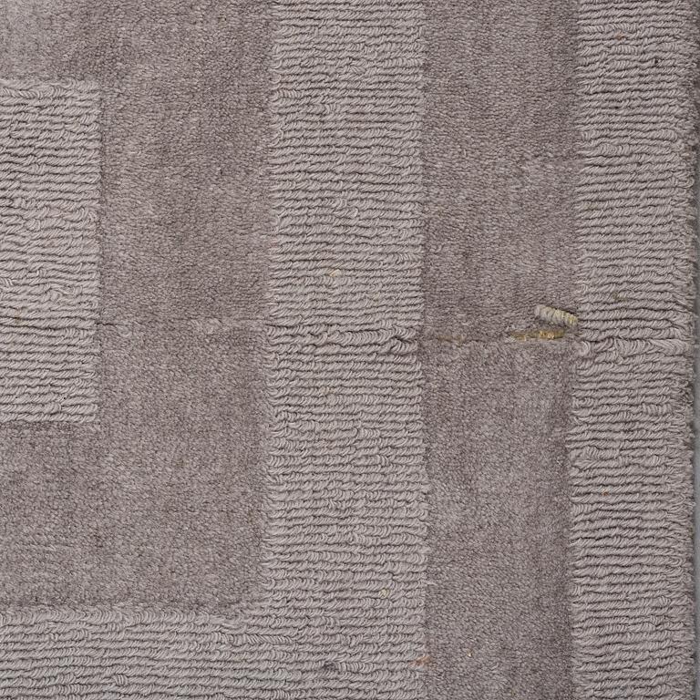 A Layered "Wool Cubes" carpet, 390x620 cm.