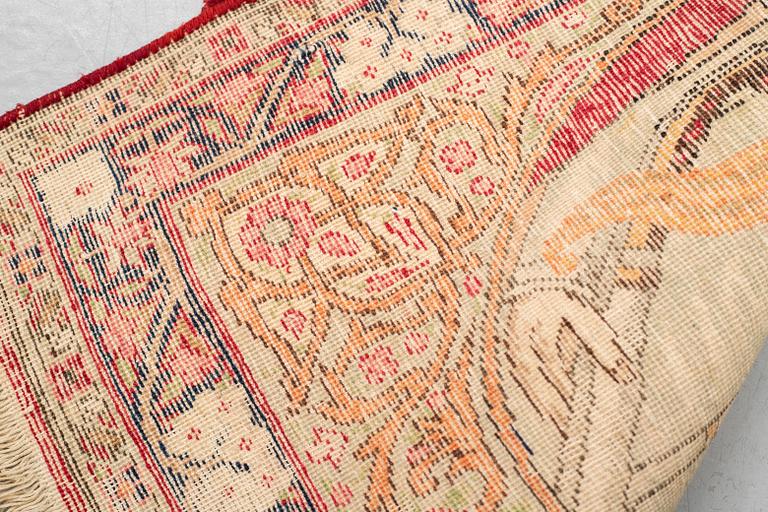A rug, Antique Kerman laver, ca  68 x 45 cm.