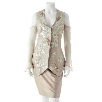 396. GIANFRANCO FERRÉ, a beige three-piece ensemble consisting of vest , trousers and skirt.