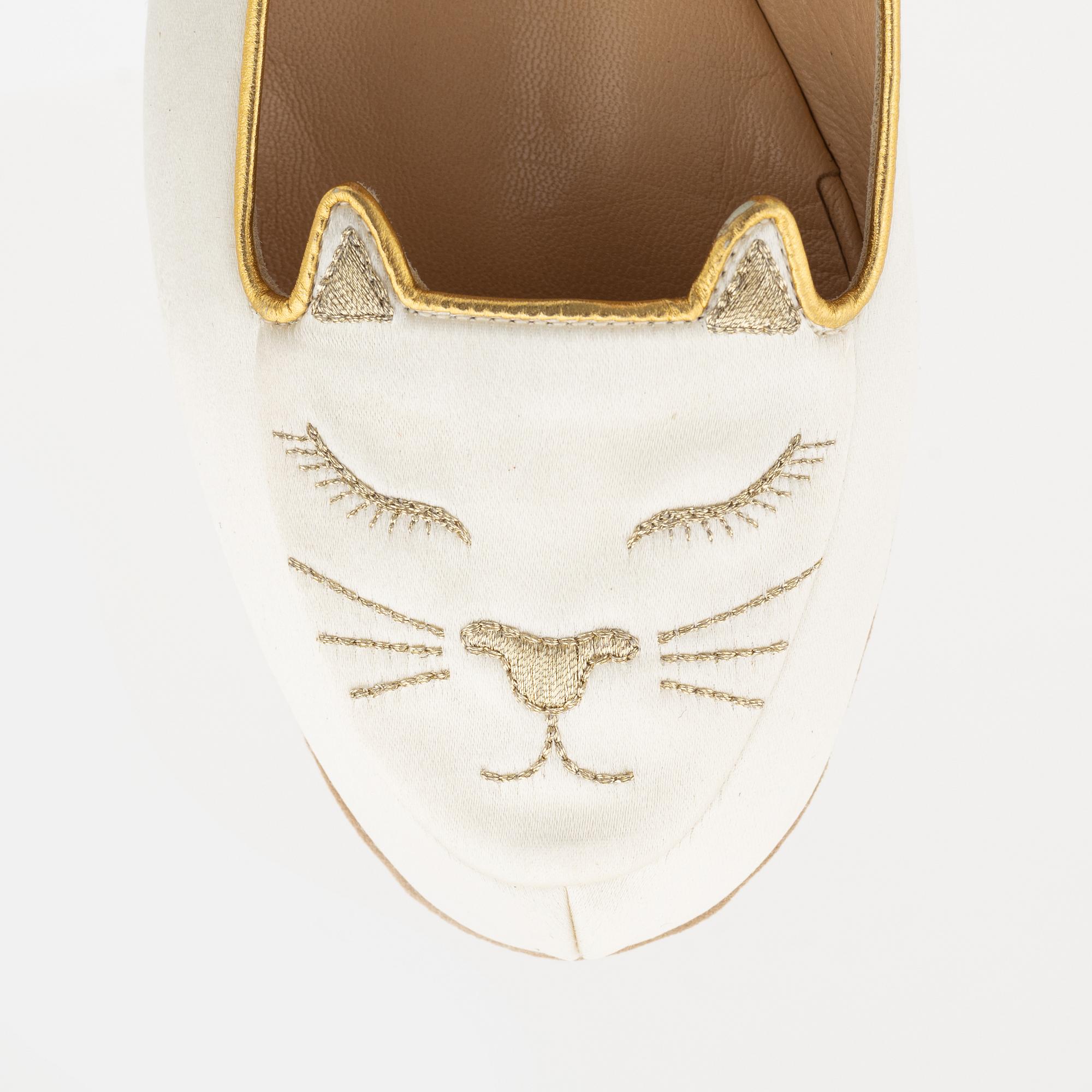 Charlotte Olympia, a pair of 'Cat nap' silk flats, a sleeping mask and a toilet bag, size S.