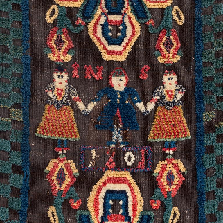A carrige cushion, knotted pile in relief, c. 104 x 48 cm, probably Skytts district dated 1801.