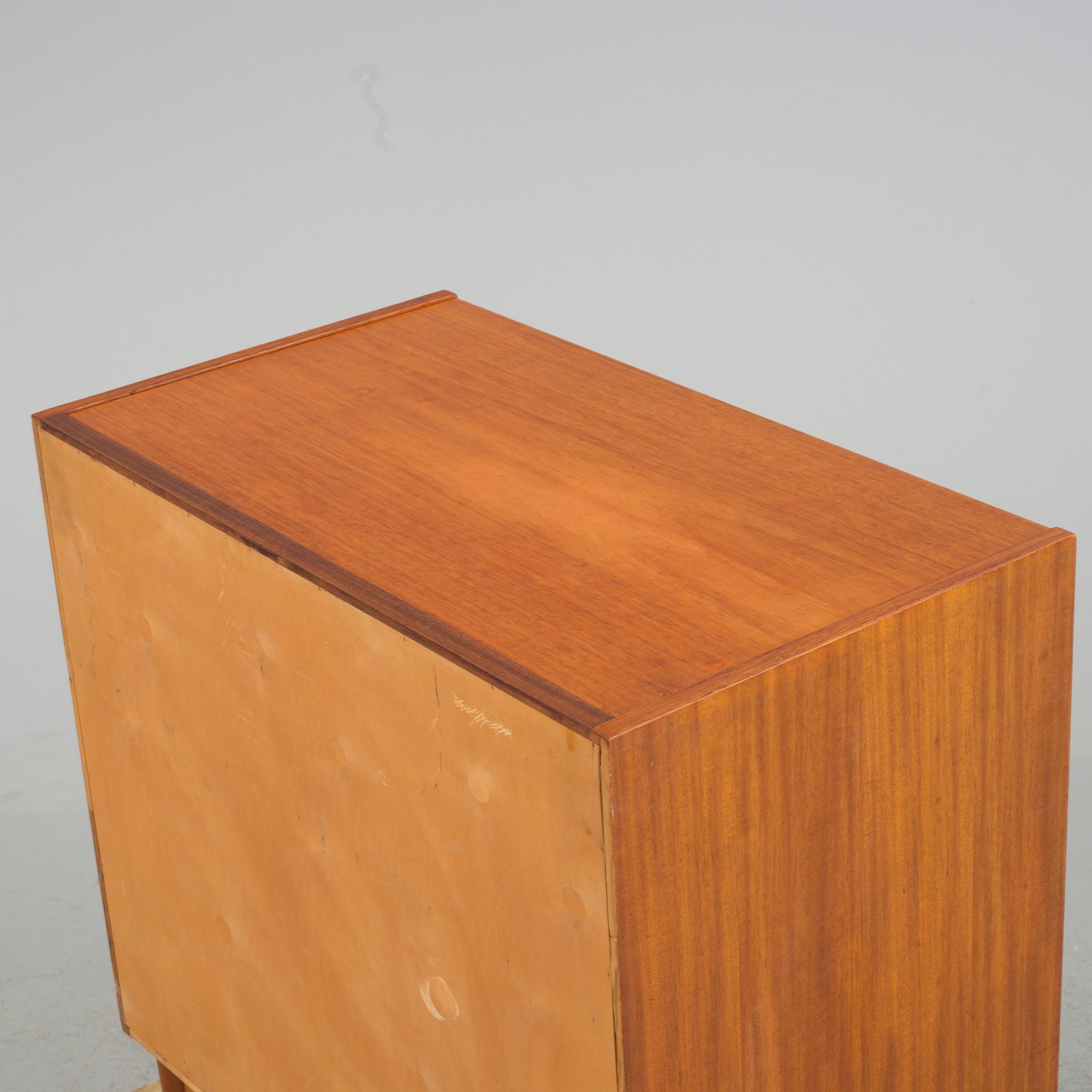 A mid 20th century teak dressing commode.