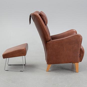 A 'Stepp' easy chair width stool by Carl-Henric Spak for Swedese.