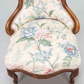 A late 19th century armchair in Rococo style.