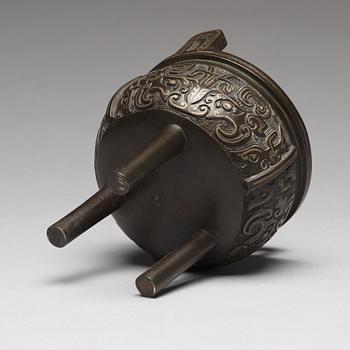 A tripod bronze censer Qing dynasty, 19th Century.